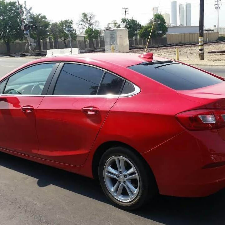 red car getting tinted at tint plus auto glass in Hanford